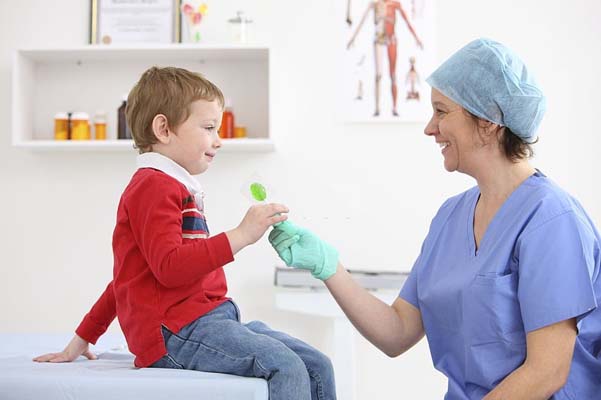Child receiving care from nurse 